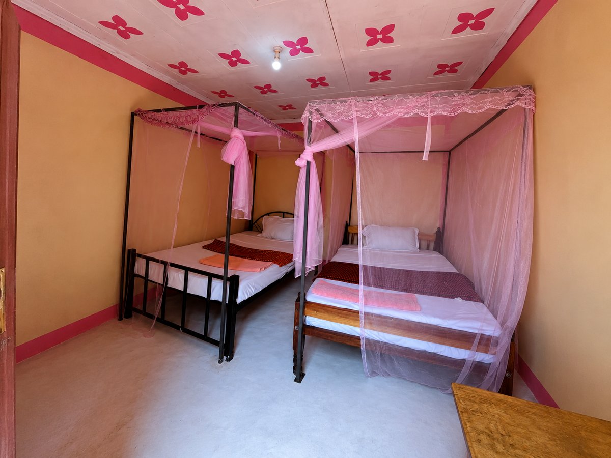 A twin bedroom inside the Loita House at Nguruman Waterfront Resort